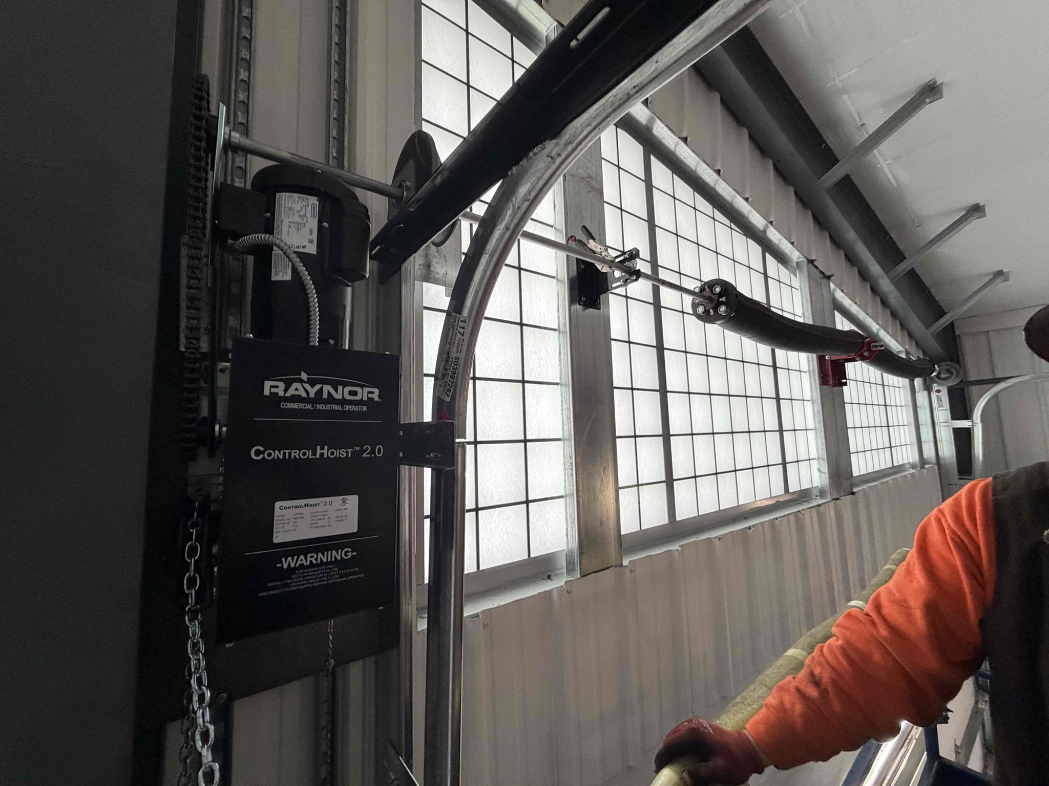 Commercial overhead door technicians working on a door project in Idaho