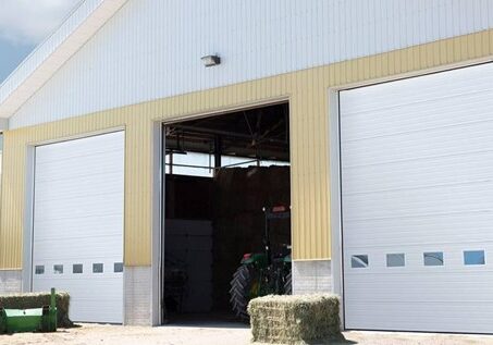 Commercial agricultural overhead door for farm and equipment storage building